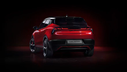 HD wallpaper featuring the rear view of a red Alfa Romeo Milano Veloce car against a dark background, highlighting its sleek design and stylish taillights.