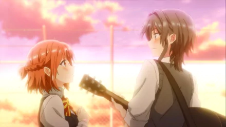 HD desktop wallpaper of two anime characters from Whisper Me a Love Song, featuring one character with short orange hair holding a guitar looking up at another character with longer hair, both bathed in the warm glow of a sunset background.