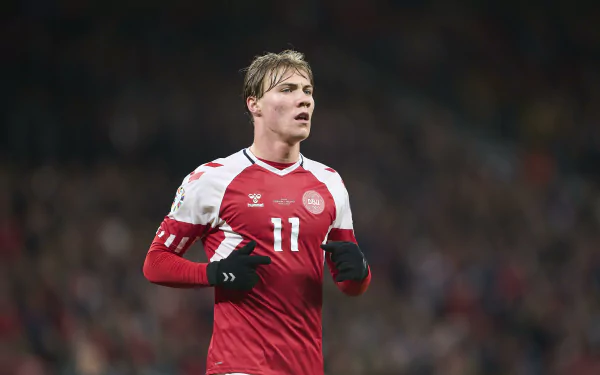 A Danish National Football Team player on the field, suitable as a soccer-themed HD desktop wallpaper and background.