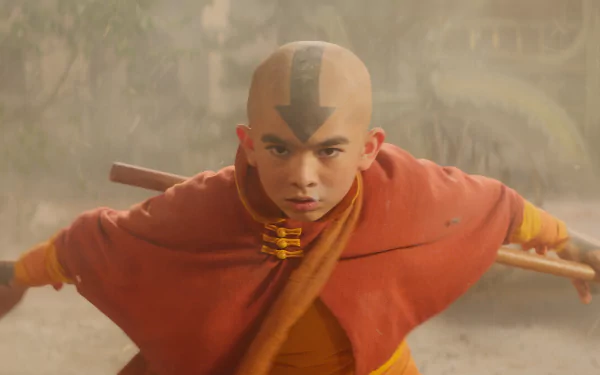 HD wallpaper of Aang from Avatar: The Last Airbender, poised for battle amidst swirling dust.