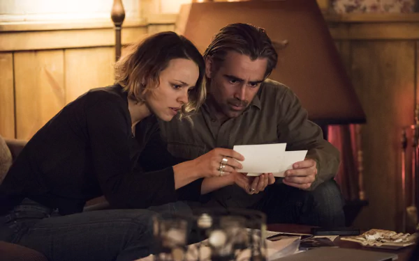 Two actors examining a document intently in a scene from the TV Show True Detective, a HD desktop wallpaper and background.