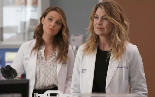 HD desktop wallpaper of two characters from Grey's Anatomy in white lab coats, possibly depicting a scene with Ellen Pompeo.