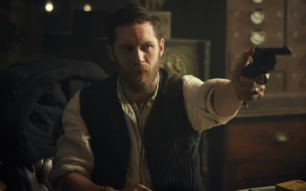 HD wallpaper featuring a character from the TV show Peaky Blinders, depicted in a dramatic scene holding a gun, evoking the intense atmosphere of the series.