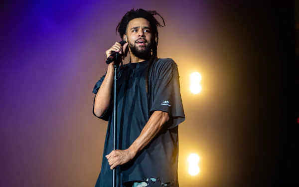 HD desktop wallpaper featuring a hip-hop artist performing on stage, tagged with music and rapper themes.