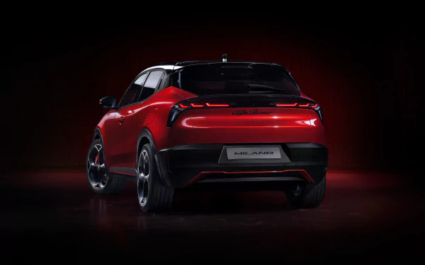 HD wallpaper featuring the rear view of a red Alfa Romeo Milano Veloce car against a dark background, highlighting its sleek design and stylish taillights.
