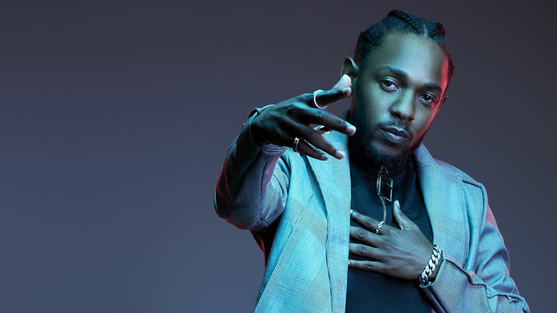 HD wallpaper of a man with braids and a jacket, posing confidently against a purple backdrop, embodying a musical theme.