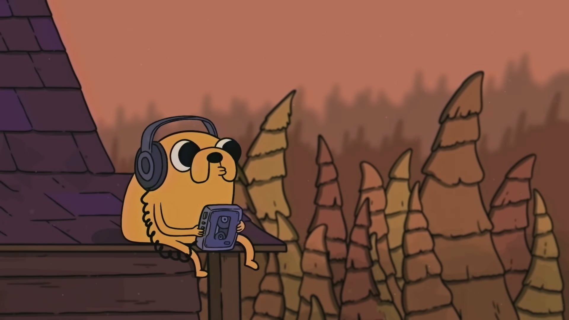 HD desktop wallpaper from Adventure Time featuring Jake the dog wearing headphones and holding a video game controller, set against a twilight landscape.