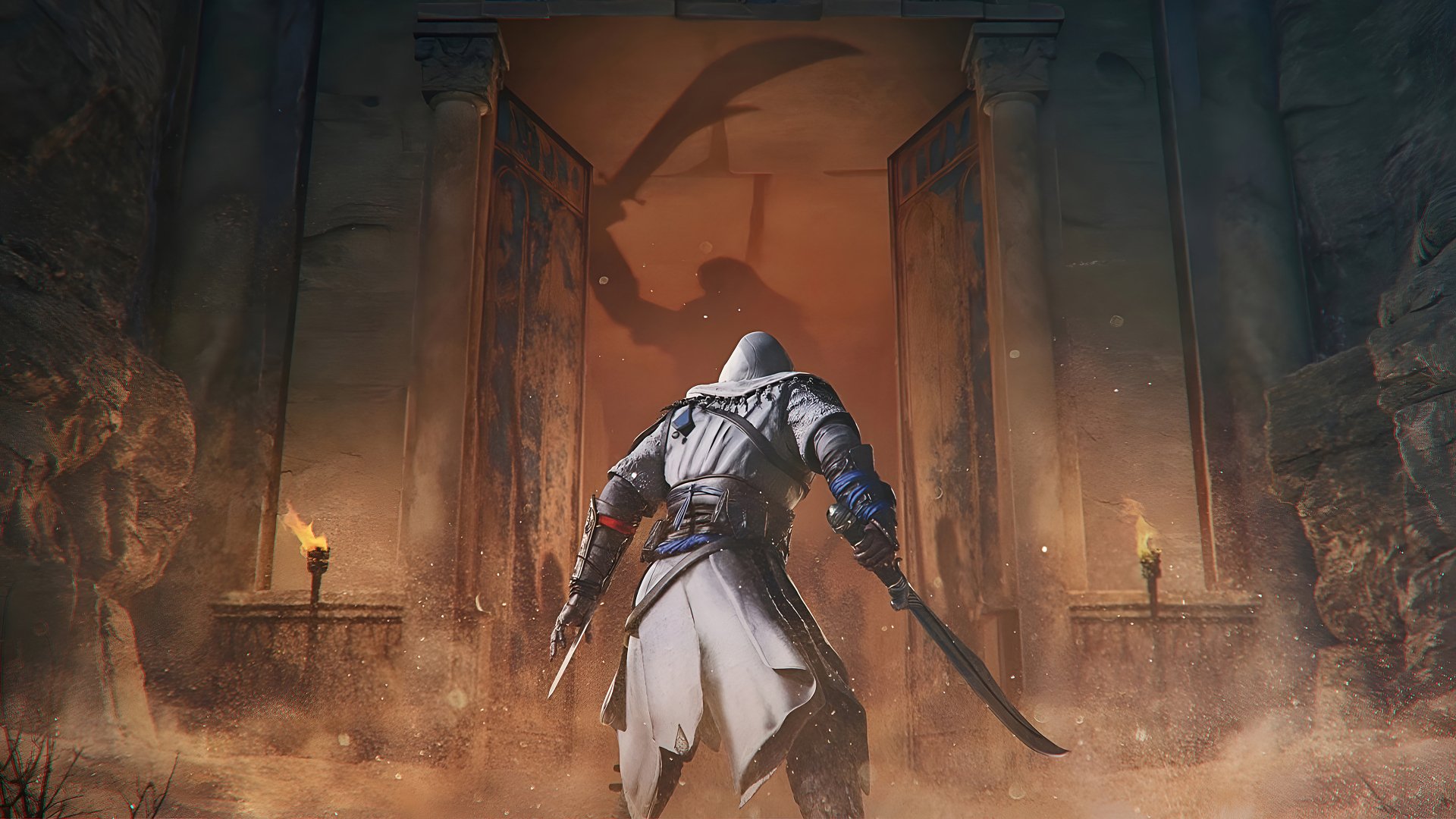 HD desktop wallpaper featuring an Assassin from Assassin's Creed Mirage standing before an ornate, mysterious doorway, with torches illuminating the entrance and a warrior shadow cast on the wall.