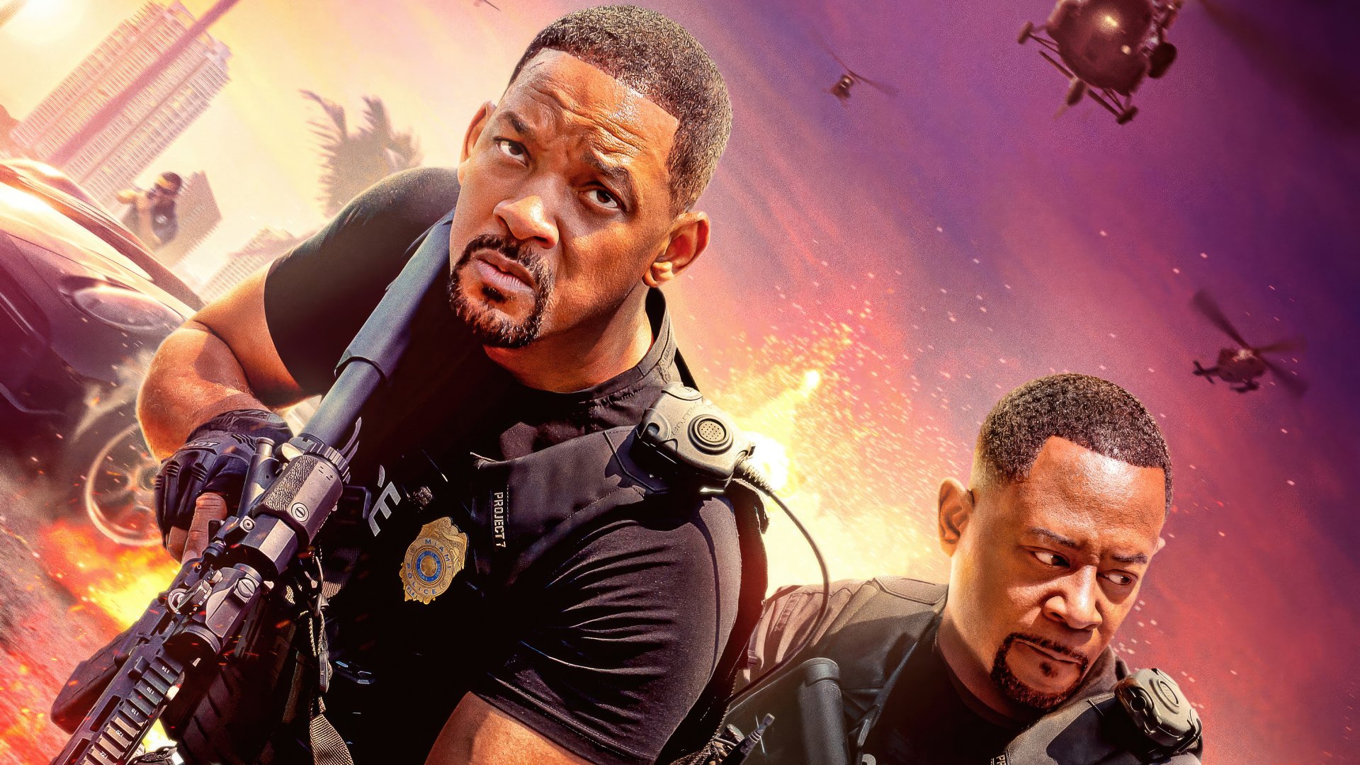 HD desktop wallpaper featuring Will Smith and Martin Lawrence in an action-packed scene from the movie Bad Boys: Ride or Die, with helicopters and cityscape in the background.