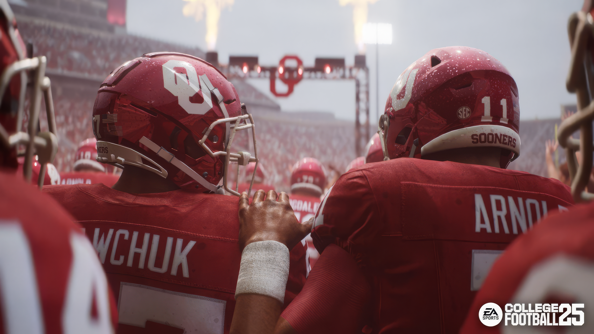 HD wallpaper of EA Sports College Football 25, featuring two football players with helmets and jerseys, standing together on the field with a crowd and stadium backdrop.