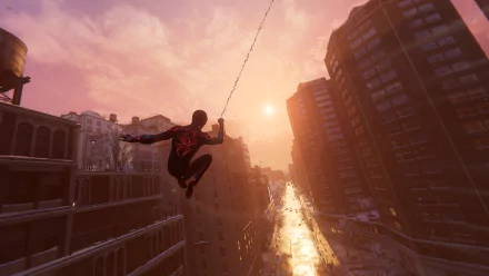 HD PC desktop wallpaper of Spider-Man from the PlayStation video game, swinging on a web above a sunlit city street at sunset.