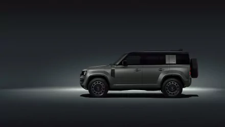 HD desktop wallpaper featuring a sleek Land Rover Defender Octa against a dark background.