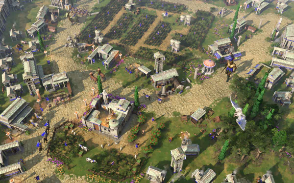 HD desktop wallpaper and background featuring an intricate town scene from the video game Age of Mythology: Retold, showcasing detailed buildings and greenery in an ancient mythological setting.