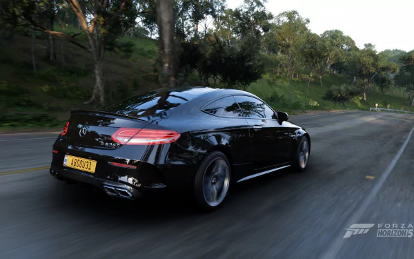 HD PC desktop wallpaper featuring a black Mercedes-AMG C 63 S speeding on a forest road in the video game Forza Horizon 5.