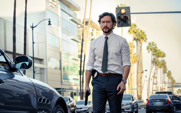 HD wallpaper showing Joseph Gordon-Levitt on a street with palm trees, holding a gun. The image is tagged with movie Beverly Hills Cop: Axel F.