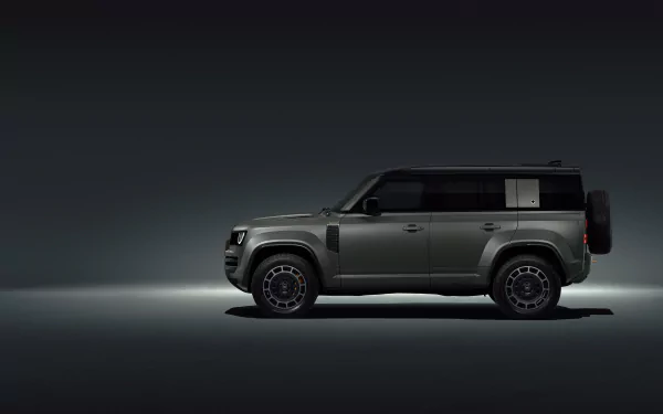 HD desktop wallpaper featuring a sleek Land Rover Defender Octa against a dark background.