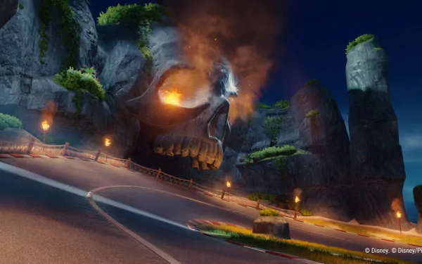 HD desktop wallpaper and background featuring a scene from the video game Disney Speedstorm, showcasing a fiery skull-shaped rock structure along a winding road.