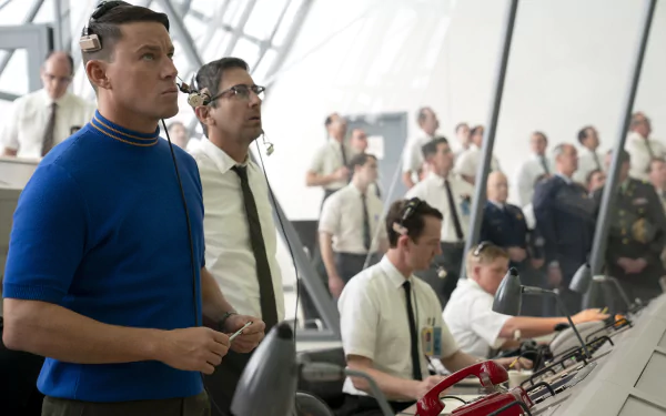 HD desktop wallpaper featuring Channing Tatum in a scene from Fly Me to the Moon (2024), showcasing a busy control room with several men wearing headsets and focused on their tasks.