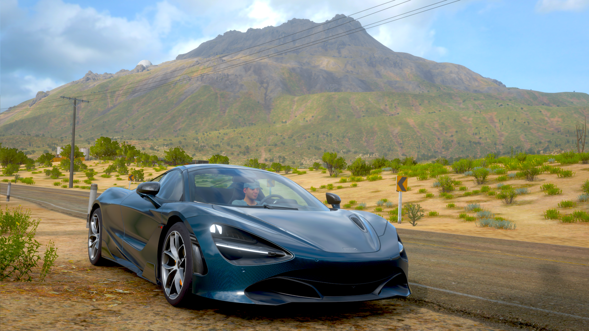 Forza Horizon 5 4K Ultra HD PC desktop wallpaper: sleek blue supercar on a desert road with mountains and a bright sky.