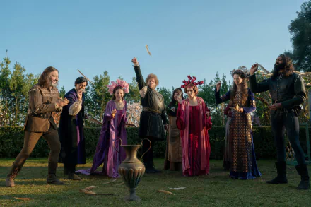 A vibrant scene from the TV show The Decameron, featuring a group of characters in historic costumes, joyfully interacting in a lush outdoor setting. مناسب كشاشة خلفية بدقة عالية.
