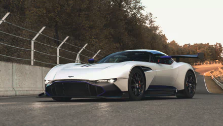 A stunning Aston Martin Vulcan parked on a racetrack, showcasing its sleek design and powerful presence, captured in a high-definition desktop wallpaper.
