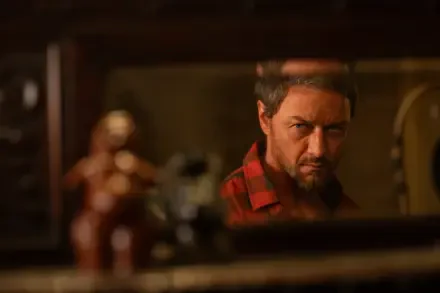 James McAvoy stares intensely into a mirror in a scene from the movie Speak No Evil. This captivating image serves as an 8K Ultra HD desktop wallpaper.
