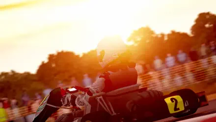  Karting At Sun-Blinding Sunset focused in helmet