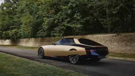 A sleek DS SM Tribute vehicle parked on a scenic road, framed by lush greenery, showcased as a stunning 4K Ultra HD PC desktop wallpaper and background.