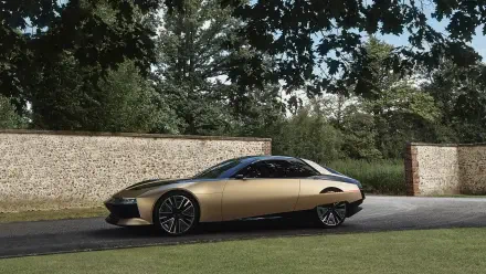 A sleek DS SM Tribute car parked beside a stone wall under trees, captured in a 4K Ultra HD PC desktop wallpaper and background.
