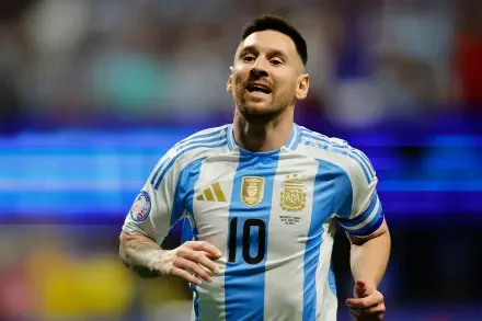 Lionel Messi celebrates on the field, wearing the Argentina National Football Team jersey. A vibrant action shot capturing the spirit of soccer in stunning 4K Ultra HD.