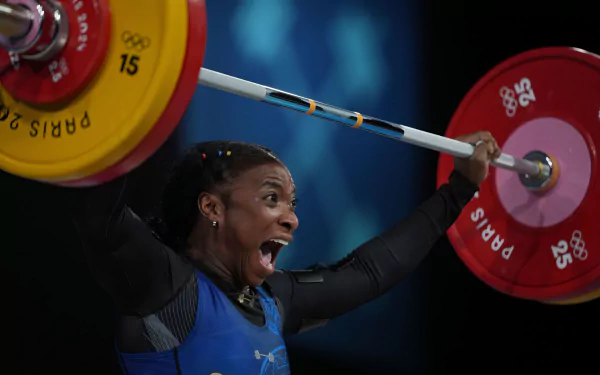 High-definition wallpaper featuring weightlifting, celebrating Colombia's participation in the Olympic Games Paris 2024. Embrace the spirit of sports and competition.