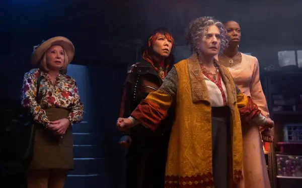 A dramatic scene from the TV show Agatha All Along, featuring four women in striking outfits, set against a moody background, presented in 4K Ultra HD as a dynamic PC desktop wallpaper.