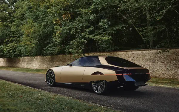 A sleek DS SM Tribute vehicle parked on a scenic road, framed by lush greenery, showcased as a stunning 4K Ultra HD PC desktop wallpaper and background.