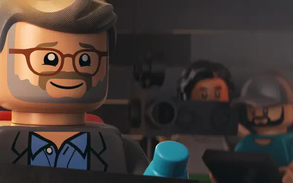 A colorful HD desktop wallpaper from the movie Piece by Piece, featuring LEGO characters, including a smiling figure with glasses, set against a cinematic backdrop.