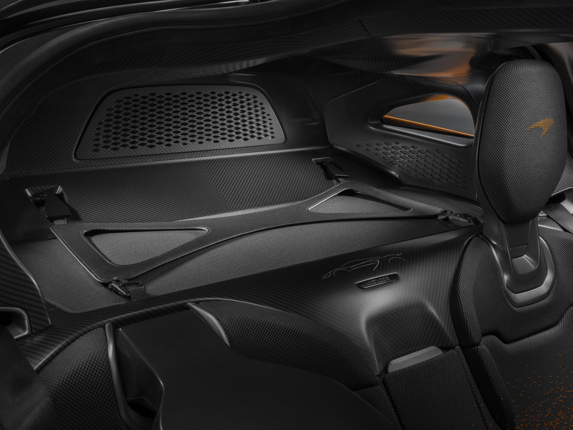 Close-up view of the sleek interior of a McLaren W1, showcasing its modern design and high-performance features. An 8K Ultra HD PC desktop wallpaper and background.
