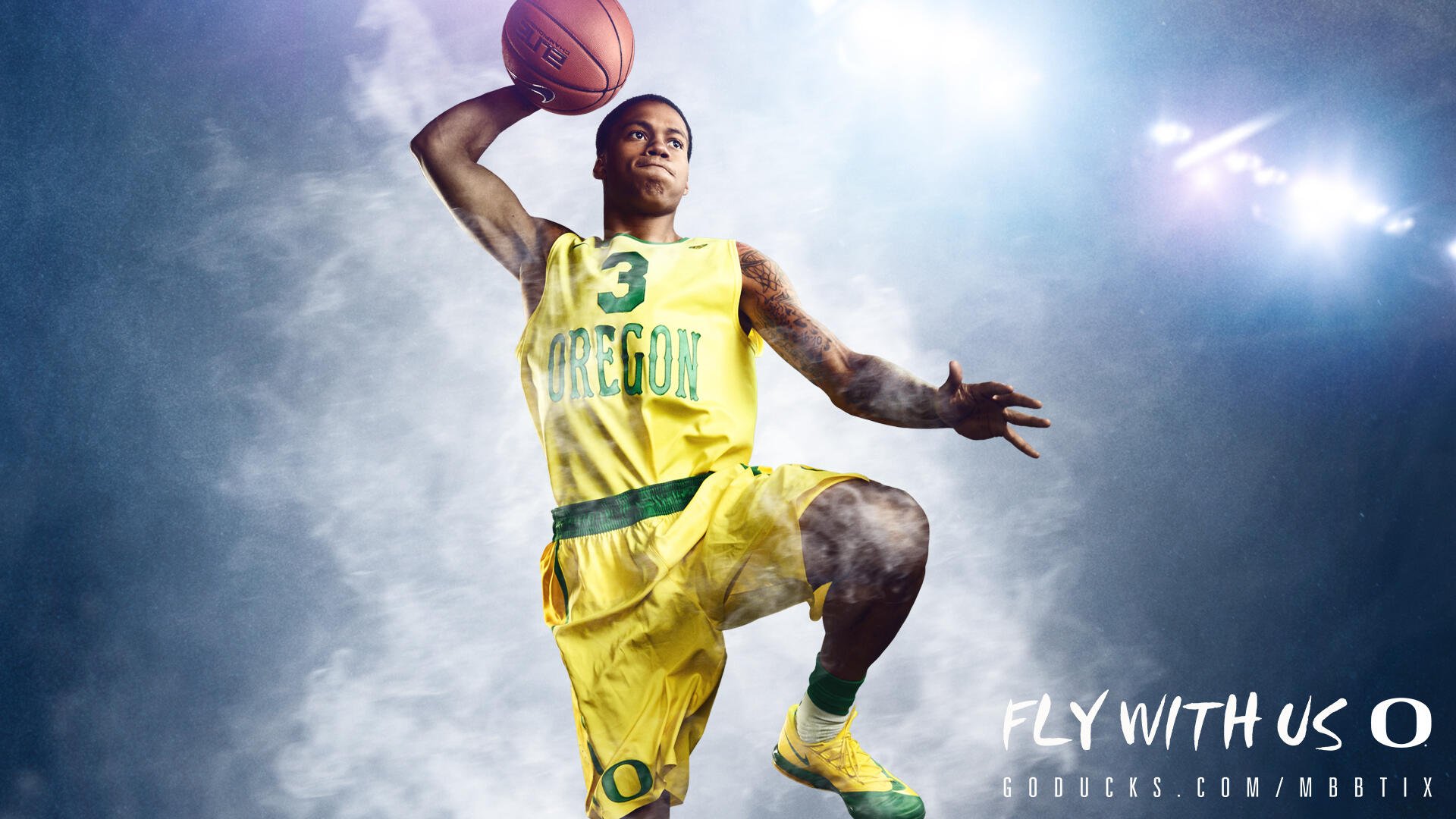A dynamic HD wallpaper featuring an Oregon Ducks basketball player in a vibrant yellow uniform, capturing the energy and excitement of the game.