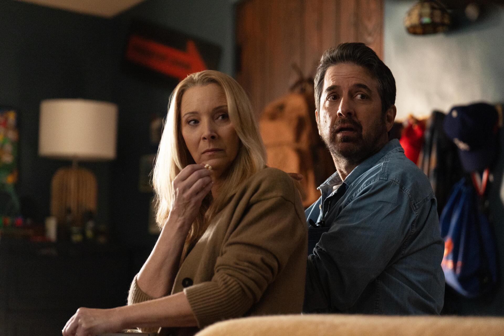 Lisa Kudrow and Ray Romano share a tense moment in a scene from the TV show No Good Deed (2024). This 4K Ultra HD wallpaper captures the show's dramatic essence.