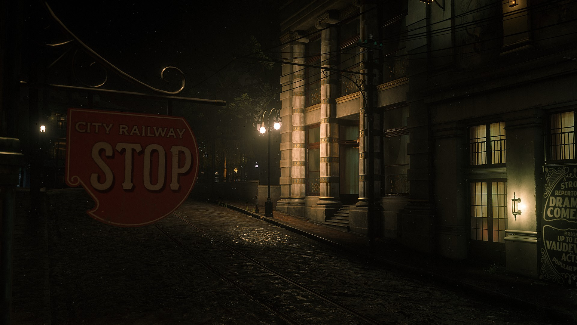 Dark, atmospheric Red Dead Redemption 2 HD PC desktop wallpaper: moonlit cobblestone street at night with a vintage STOP railway sign and lit stone building windows.