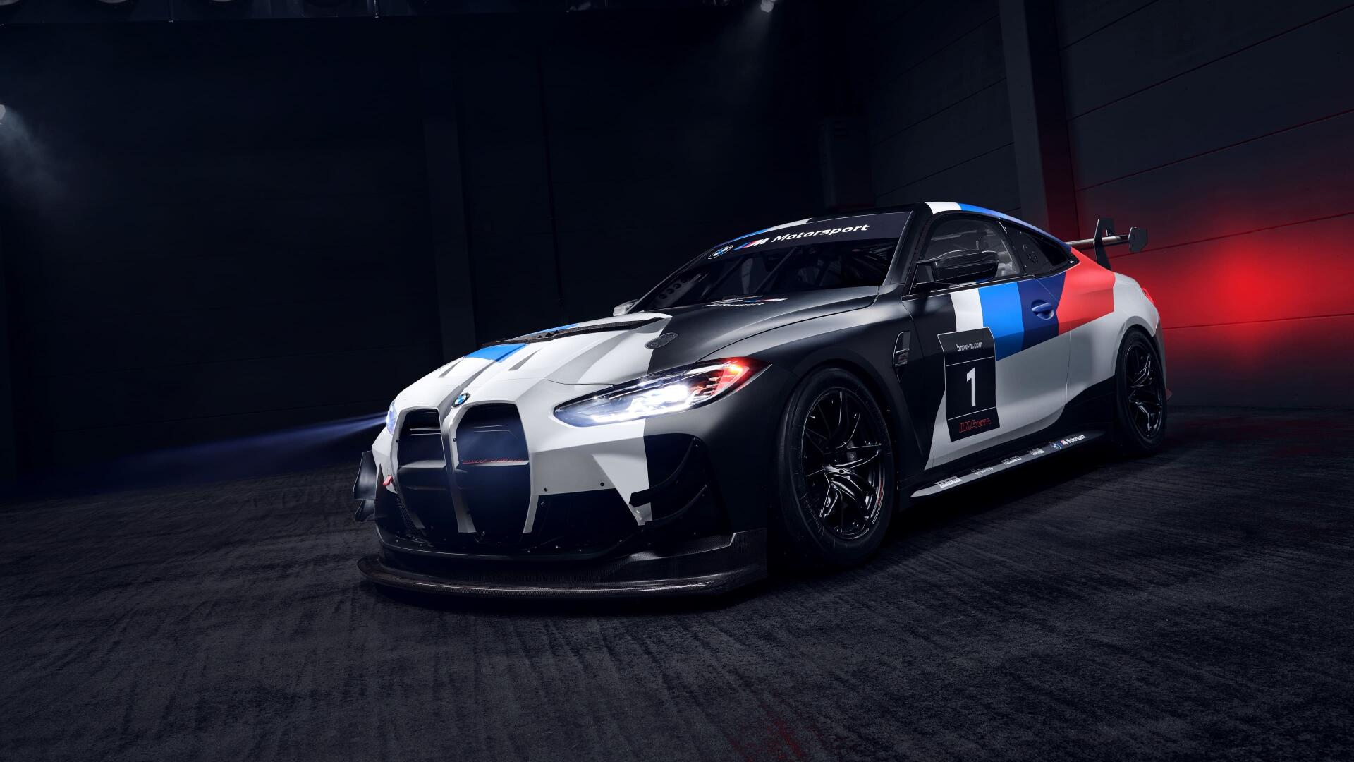 Sleek BMW M4 race car with iconic blue and red accents, showcased in a high-definition 4K Ultra HD PC desktop wallpaper.