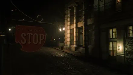 Dark, atmospheric Red Dead Redemption 2 HD PC desktop wallpaper: moonlit cobblestone street at night with a vintage STOP railway sign and lit stone building windows.