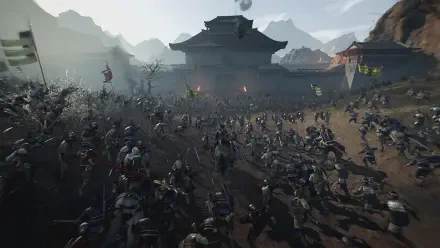 A dynamic scene from Dynasty Warriors: Origins, showcasing a battle-filled landscape with numerous warriors clashing, set against a dramatic mountain backdrop. HD PC desktop wallpaper.