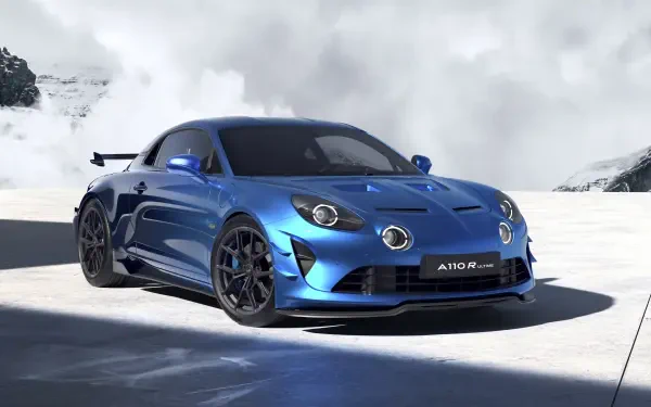 A sleek blue Alpine A110 R Ultime sports car showcased on a snowy mountain backdrop, rendered in 4K Ultra HD for a striking PC desktop wallpaper.