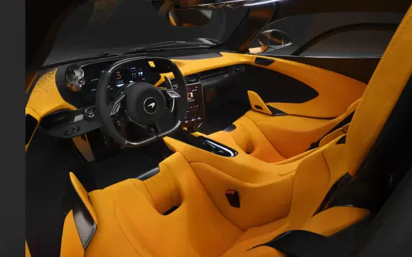 A stunning interior shot of a McLaren W1, showcasing its sleek design with vibrant orange upholstery, a modern dashboard, and an advanced steering wheel, all captured in 4K Ultra HD quality.