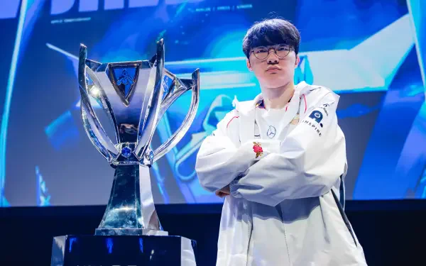 A high-definition wallpaper showcasing the esports champion Faker from T1, confidently posing with a trophy in a League of Legends setting.