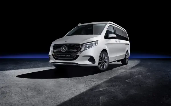 A sleek Mercedes-Benz V-Class Marco Polo showcased in 4K Ultra HD, highlighting its modern design against a dark background, emphasizing elegance and versatility.