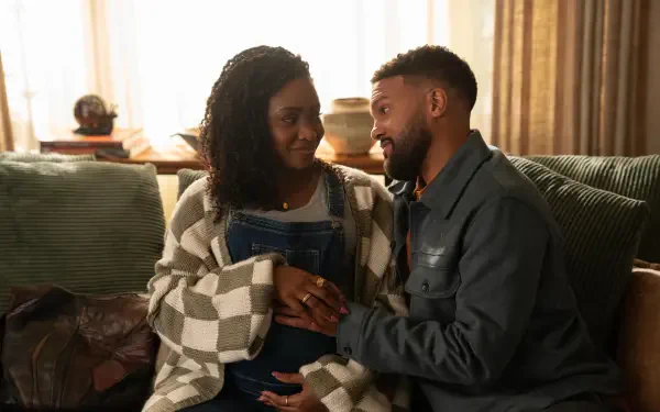 A tender moment between two characters in No Good Deed (2024), showcasing Teyonah Parris in a cozy 4K Ultra HD scene filled with warmth and intimacy.