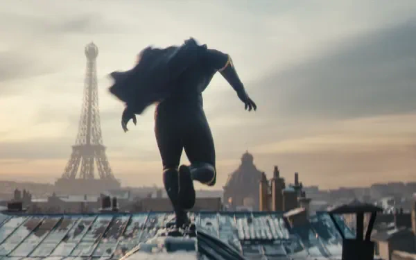 A dynamic scene from the video game MARVEL 1943: Rise of Hydra, featuring a character leaping across rooftops with the Eiffel Tower in the background, showcasing vibrant HD visuals.