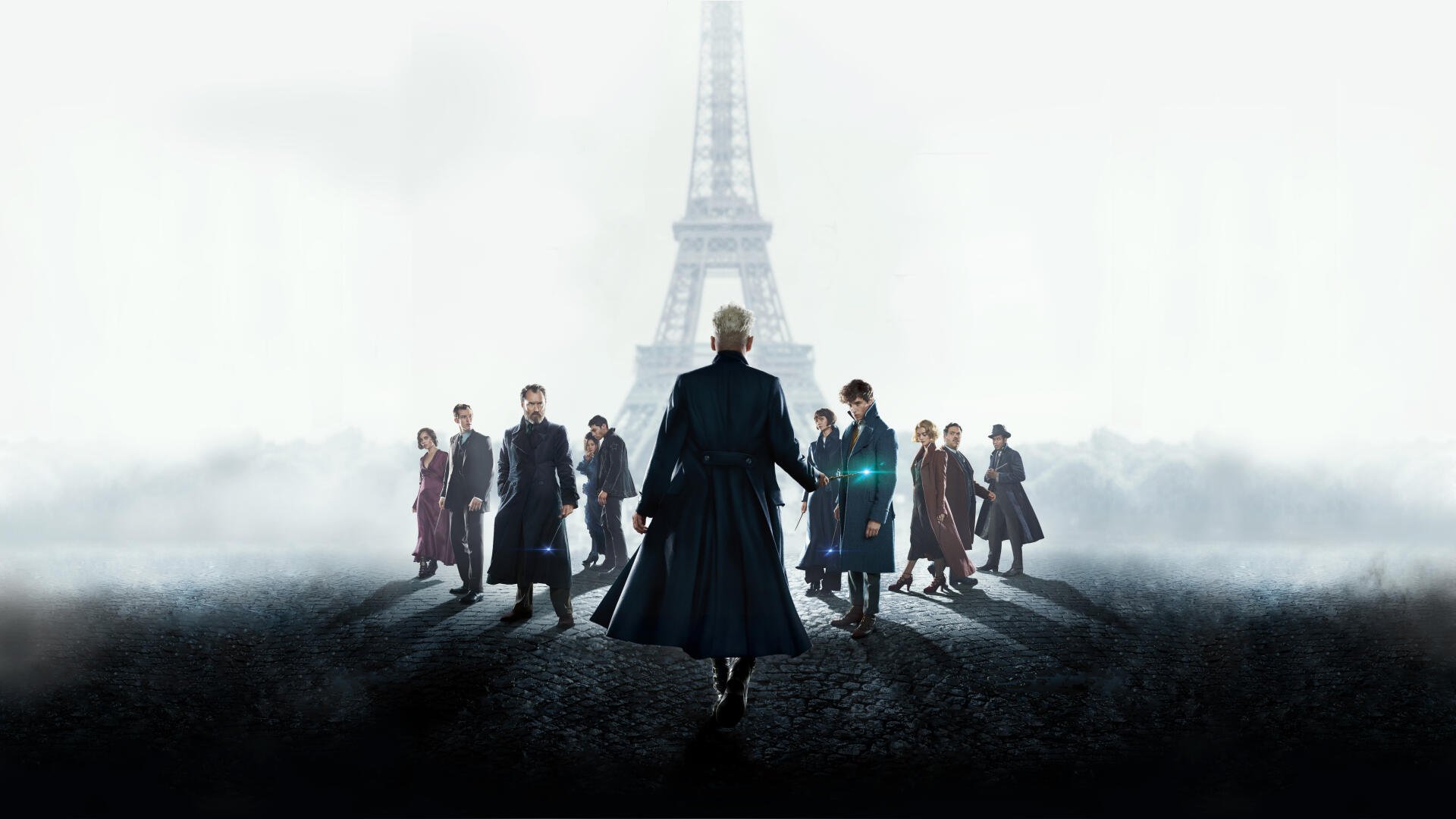 Fantastic Beasts: The Crimes of Grindelwald 4K Ultra HD PC desktop wallpaper showing Grindelwald's silhouette leading a group across a foggy Paris street with the Eiffel Tower looming.