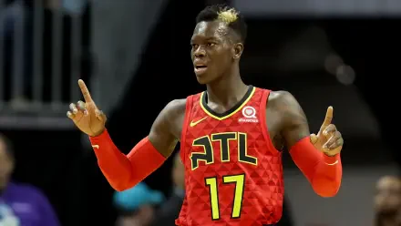Dennis Schröder celebrates during an NBA game, wearing the Atlanta Hawks' red uniform with the number 17. A dynamic moment captured in a vibrant HD desktop wallpaper.