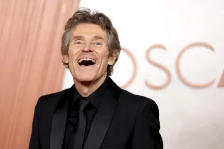 Willem Dafoe smiles brightly on the red carpet at the Academy Awards, captured in a vibrant 4K Ultra HD wallpaper.